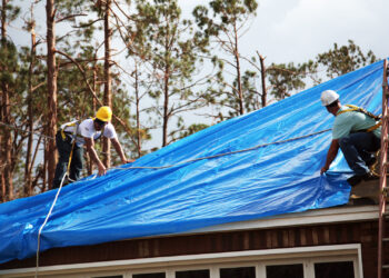 U.S. Army Corps of Engineers workers install temporary roofing on homes of Florida Panhandle residents as part of Operation Blue Roof following Hurricane Michael in 2018 (Pfc. Kaleah Fields/CAISE, via Defense Visual Information Distribution Service)