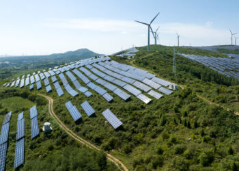 Solar panels and wind turbines on a mountain in China (iStock image)