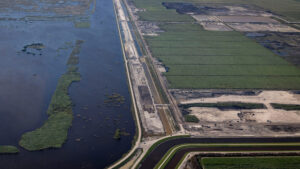 The construction site of the Everglades Agricultural Area reservoir, to the right, lies alongside a flow equalization basin, designed to store stormwater. (Credit: Jose Iglesias/Miami Herald)