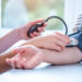 A doctor measures the blood pressure of a patient (iStock image)