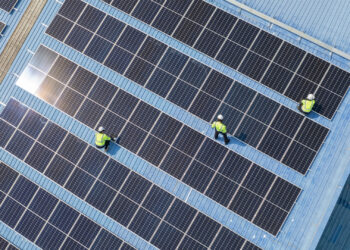 Solar panels on a factory rooftop (iStock image)