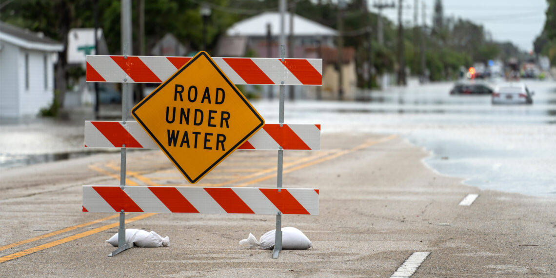 A sign on a Sarasota street closed due to flooding from Hurricane Debby (iStock image)