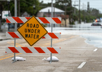 A sign on a Sarasota street closed due to flooding from Hurricane Debby (iStock image)