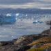 A man looks at icebergs off the coast of Greenland (iStock image)