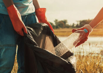 Plastic waste is picked up from a waterway during a cleanup (iStock image)