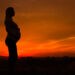 A silhouette of a pregnant woman outdoors (IStock image)