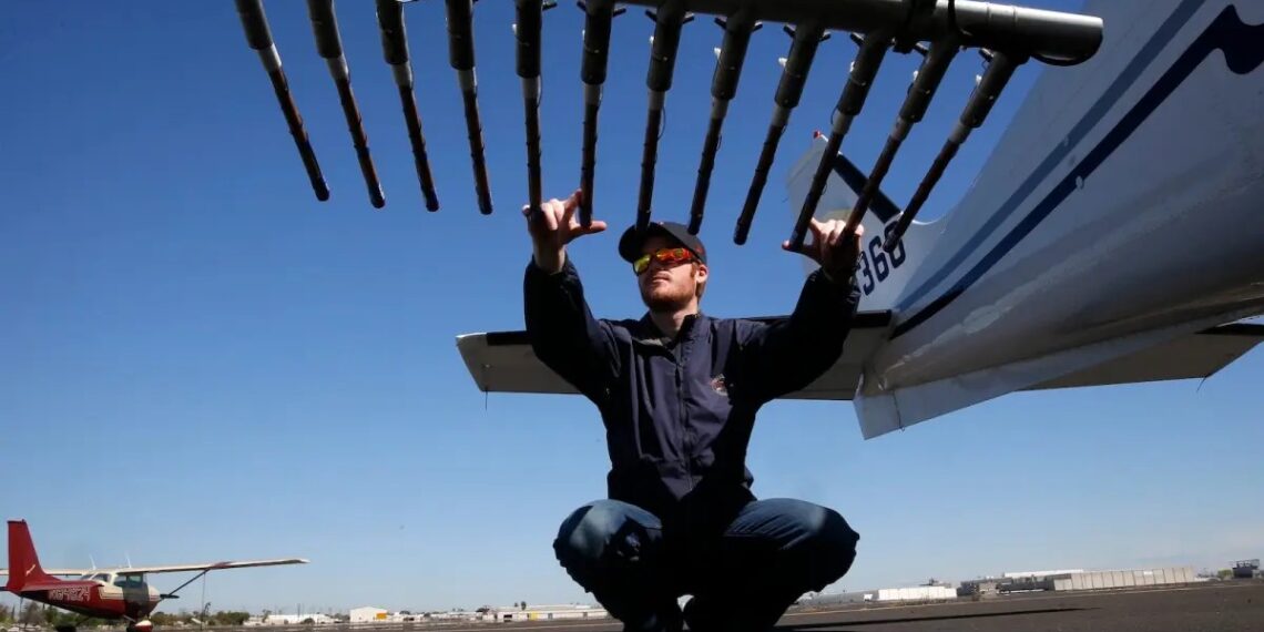 Specially equipped aircraft with flares mounted under each wing contain the silver iodide that is released as the pilots fly over the Sierra foothills to load clouds so they produce more precipitation. (Michael Macor/The San Francisco Chronicle/Getty Images via Grist)