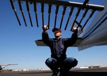 Specially equipped aircraft with flares mounted under each wing contain the silver iodide that is released as the pilots fly over the Sierra foothills to load clouds so they produce more precipitation. (Michael Macor/The San Francisco Chronicle/Getty Images via Grist)