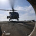An MH-60R Sea Hawk helicopter lands on the flight deck of Arleigh Burke-class guided-missile destroyer USS Thomas Hudner (DDG 116) during flight deck operations while underway during Operation Epic Fury, Mar. 16, 2026. (NAVCENT Public Affairs, Public domain, via Wikimedia Commons)