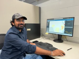 Sunil Kumar working on a Vibrio surveillance tool at the University of Florida. (Zoya Teirstein/Grist)