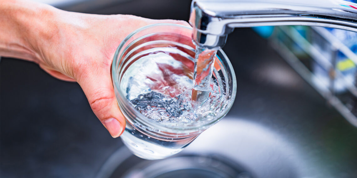 Water being poured into a glass from a faucet (iStock image)