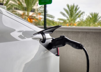 An electric vehicle charging in a parking garage in St. Petersburg. (iStock image)
