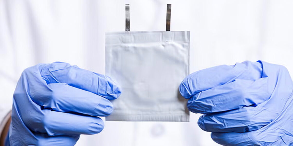Doctoral student Peng Wang holds an aqueous zinc-ion battery. (Scott Holstein/FAMU-FSU College of Engineering)