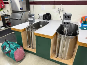 Parents and alumni at the private New Hampton School in New Hampshire pooled enough funds to purchase standing immersion tubs for the athletics program. Private schools can often tap donors to go beyond the minimum requirements of state safety mandates. (Neal Morton/The Hechinger Report)