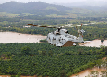 A helicopter conducted aerial surveys over Honduras to gauge the damage from Hurricane Eta. (Robert Oates/MOD, OGL v1.0OGL v1.0, via Wikimedia Commons)