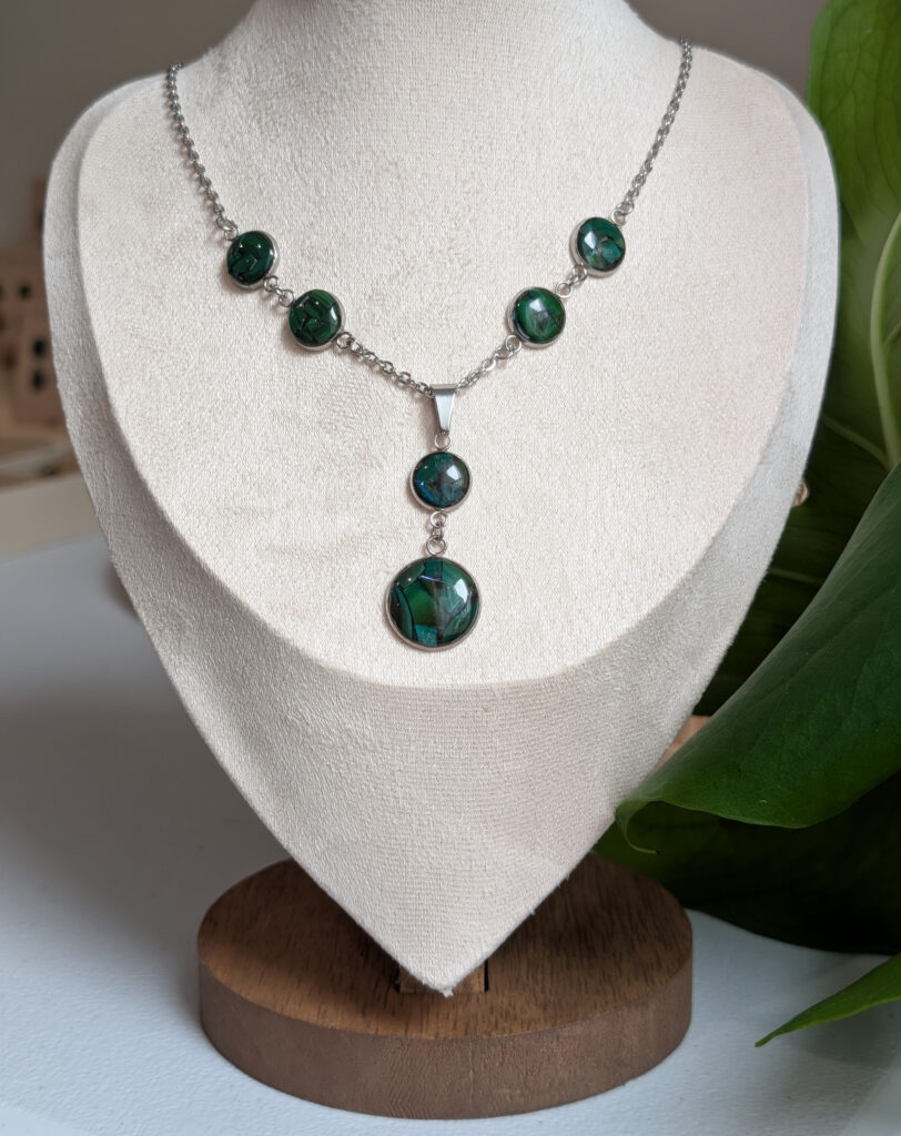 Jennifer Comeau turns invasive Asian green mussels into jewelry. (Photo courtesy of Jennifer Comeau)