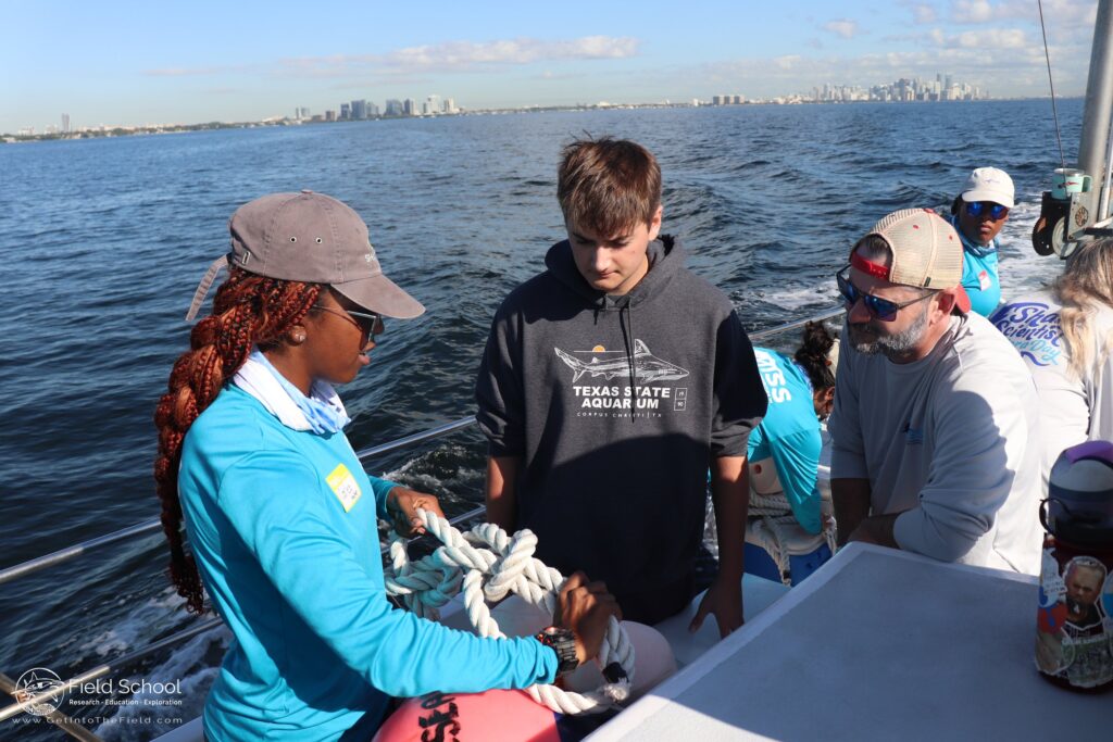 A member of MISS handles a nautical knot during a “Shark Scientist for a Day” trip in December 2024. (Credit: MISS)