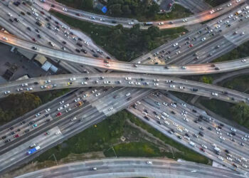 An aerial view of a highway interchange (Chris Sattlberger/Tetra Images via Getty Images)