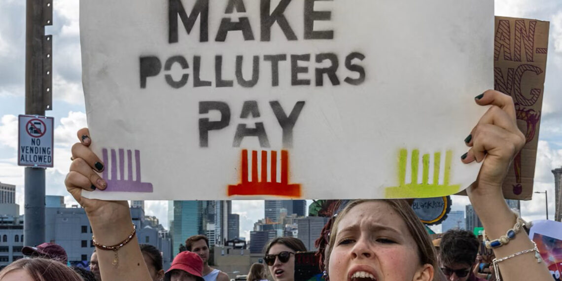 Activists cross the Brooklyn Bridge during a Youth Global Climate demonstration ahead of the UN Climate Week in New York City in 2024. (Alex Kent/AFP via Getty Images)