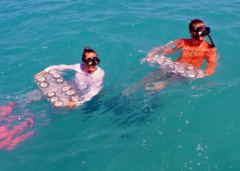 Carly Dennison (left) and Jordan Holder from the Rosenstiel School, prepare to outplant Flonduran and Florida elkhorn corals in the Dry Tortugas, Florida Keys. (Bailey Marquardt, Coral Reef Futures Lab)