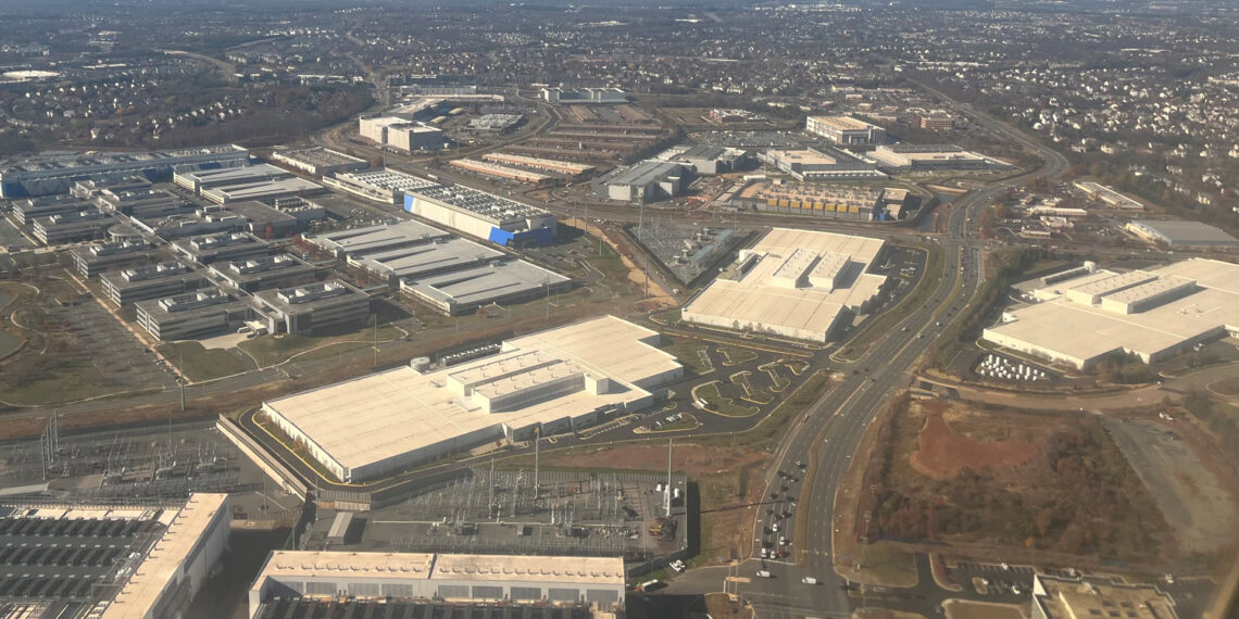 An aerial view of data centers intermingled with other commercial buildings in Loudoun County, Virginia (Theodore Christopher, CC0, via Wikimedia Commons)