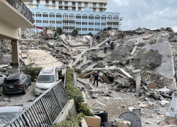 A ground view of the partially collapsed Champlain Towers South condo building in 2021 (Miami-Dade Fire Rescue Department, Public domain, via Wikimedia Commons)