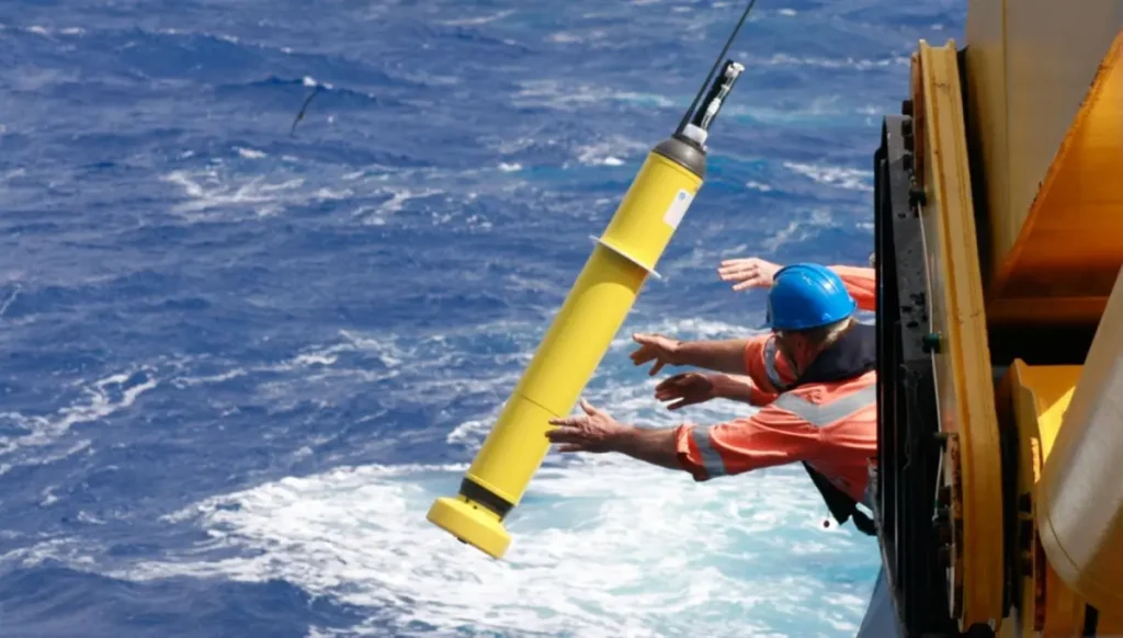 Researchers deploy an Argo float in 2009. (Alicia Navidad, National Science Foundation/The Commonwealth Scientific and Industrial Research Organisation)
