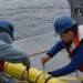 Researchers prepare to deploy a glider instrument into the ocean. (Photo by Rebecca Travis/Woods Hole Oceanographic Institution)