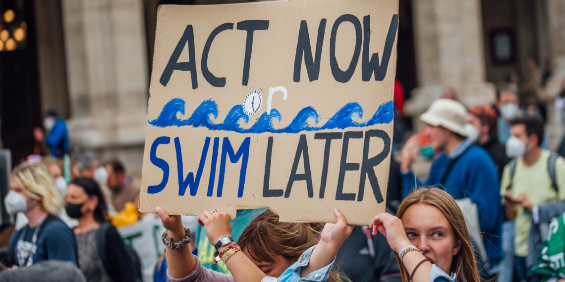 Demonstrators at a rally calling for climate action (Ivan Radic, CC BY 2.0, via Wikimedia Commons)