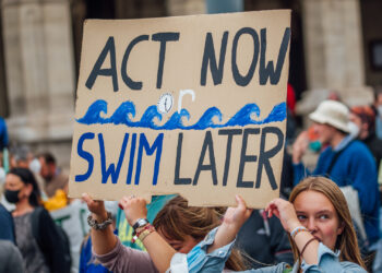 Demonstrators at a rally calling for climate action (Ivan Radic, CC BY 2.0, via Wikimedia Commons)