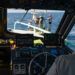 Ben Meister observes the crew members aboard a buoy in the Gulf. (Photo by Jackson Sullivan)