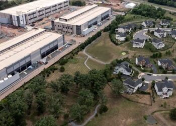 An Amazon data center sits next to a neighborhood in northern Virginia. (Nathan Howard/Getty Images)