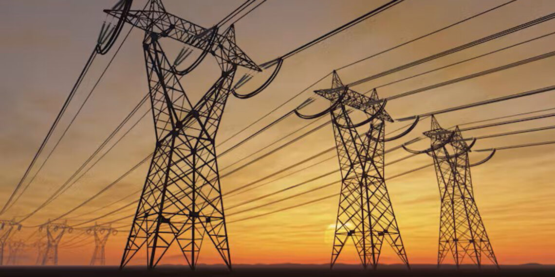 High voltage electric power lines at sunset (imaginima/iStock/Getty Images Plus)