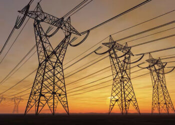 High voltage electric power lines at sunset (imaginima/iStock/Getty Images Plus)