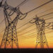 High voltage electric power lines at sunset (imaginima/iStock/Getty Images Plus)